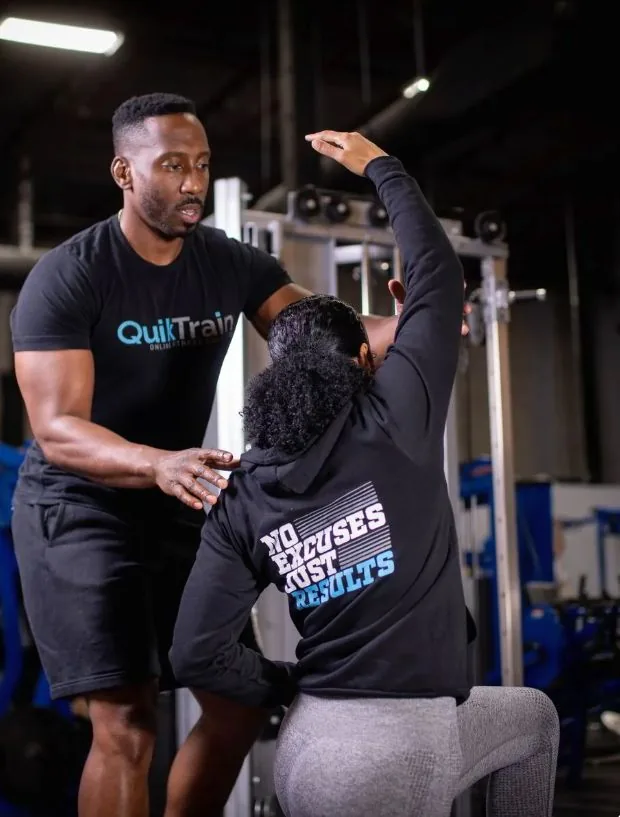 Derick Samuel, Founder & Head Coach at QuikTrain, coaching a client during a session